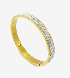 Gold bangle with stone setting